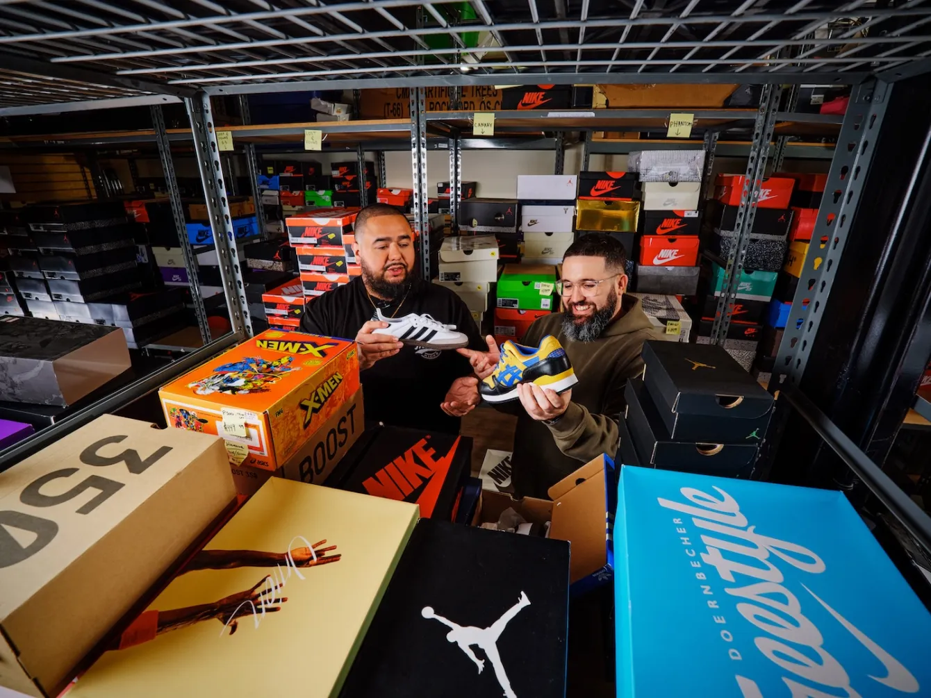 Shop owners admiring basketball shoes